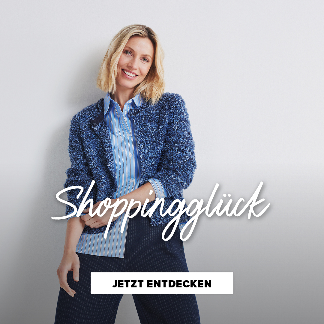Eine lächelnde Frau trägt eine blåue Jacke und ein gestreiftes Hemd. Der Text "Shoppingglück" und "Jetzt entdecken" sind prominent dargestellt.
