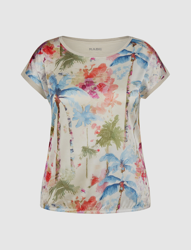 Damen-T-Shirt mit einem bunten Design aus Palmen und Blumen. Damen-T-Shirt mit einem bunten Design aus Palmen und Blumen.