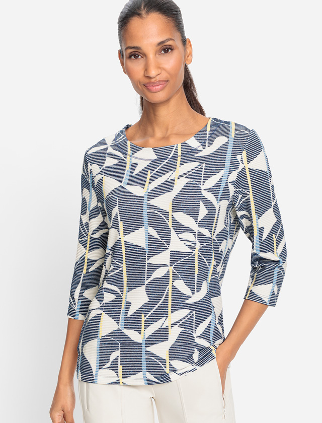 Oberteil aus blau-weißem gemustertem Stoff, der ein frisches und modernes Design präsentiert. Oberteil aus blau-weißem gemustertem Stoff, der ein frisches und modernes Design präsentiert.